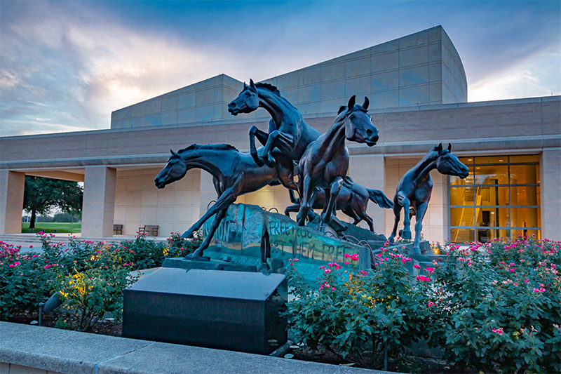 statue of horses in evening