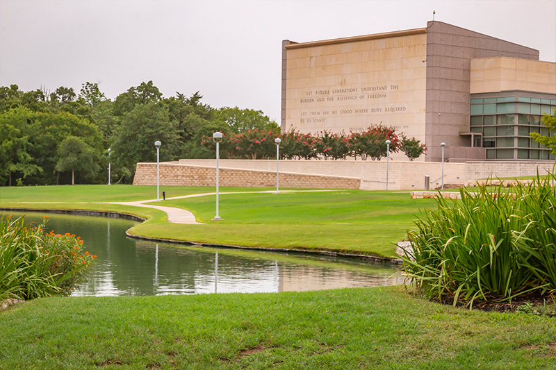 quote wall with pond in foreground